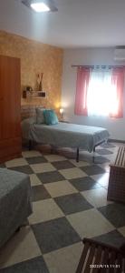 A bed or beds in a room at Casa Monte Los Peñasquitos