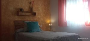 A bed or beds in a room at Casa Monte Los Peñasquitos