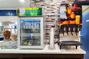 a refrigerator with its door open on a counter at Quality Inn Albany in Albany