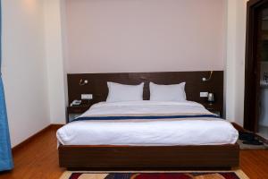 Letto o letti in una camera di Hotel Mega & Apartment