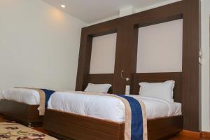 Letto o letti in una camera di Hotel Mega & Apartment