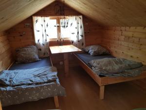 Postel nebo postele na pokoji v ubytování Hidden Tiny House