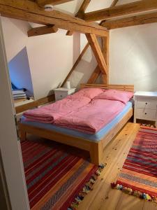 Postel nebo postele na pokoji v ubytování Ferienhaus Helge an der Schoritzer Wiek