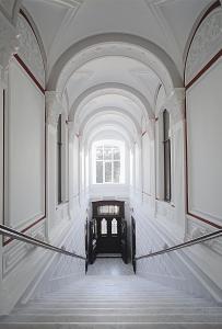 an empty hallway in a building with a window at Bonhotel in Astrakhan