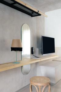 TV a/nebo společenská místnost v ubytování ecoSuites