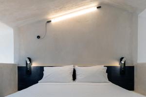 Postel nebo postele na pokoji v ubytování ecoSuites