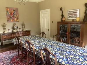 a dining room with a table with chairs and a blue and white table at Brynffynnon Boutique Bed and Breakfast in Dolgellau