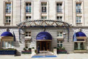 a man standing in front of a building at The Ritz London in London