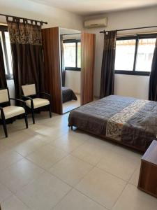 Un ou plusieurs lits dans un hébergement de l'établissement Appartement "AMINA" mit Pool