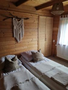 Posteľ alebo postele v izbe v ubytovaní Apartament NA PIĘTERKU