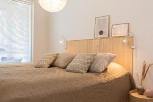 Postel nebo postele na pokoji v ubytování Tuomenkartano Apartments by Hiekka Booking