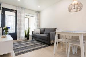 Posezení v ubytování Tuomenkartano Apartments by Hiekka Booking