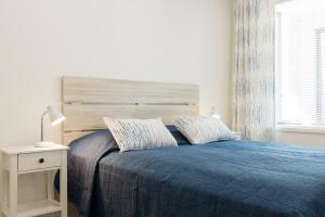 Postel nebo postele na pokoji v ubytování Tuomenkartano Apartments by Hiekka Booking