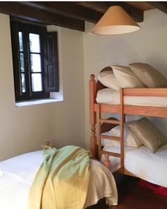 Posteľ alebo postele v izbe v ubytovaní HdeC Hosteria de Castañeda Alojamiento Turistico