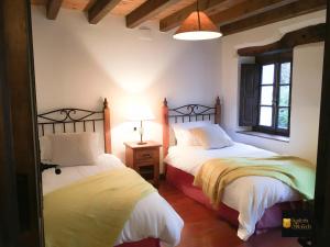 Tempat tidur dalam kamar di HdeC Hosteria de Castañeda Alojamiento Turistico