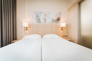 Rúm í herbergi á Tallink Spa & Conference Hotel