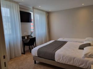 Posteľ alebo postele v izbe v ubytovaní Hôtel d'Angleterre Rouen Centre Gare