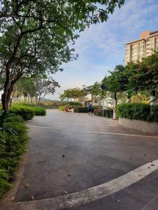 a person walking down a street in a park at Dwiputra GetAway Homestay in Putrajaya