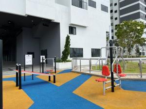 a playground in a building with two swings at C180 Cheras Traders Square Balakong As Home in Cheras