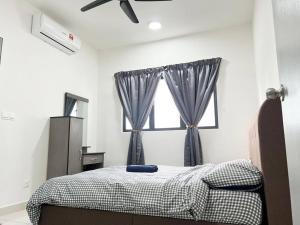 a bedroom with a bed and a window at C180 Cheras Traders Square Balakong As Home in Cheras