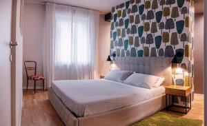 A bed or beds in a room at Casa Patrizi
