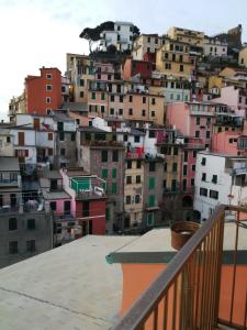 a view of a city from the roof of a building at CasaRiomaggiore "a few steps from the sea" in Riomaggiore +2 photos