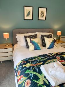 a bedroom with a bed with a colorful bedspread at Victorian Retreat in York