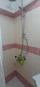 a shower in a tiled bathroom with at OPEN SPACE in Augusta