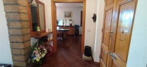 a hallway with a door and a table in a room at Casolare L'Antico Olivo in Chiesina Uzzanese +29 photos