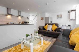 a living room with a couch and a table at Modern Family Home With Parking-Pem in Liverpool