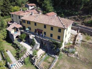 an aerial view of a large house in a village at Canapali in Longoio