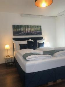 Ένα ή περισσότερα κρεβάτια σε δωμάτιο στο INN JOY Apartments - Sankt Gallen Lachen