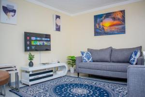 TV a/nebo společenská místnost v ubytování Arabella Suites - Karen