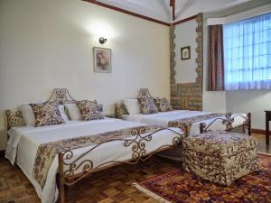 Postel nebo postele na pokoji v ubytování The Drexel House Kenya