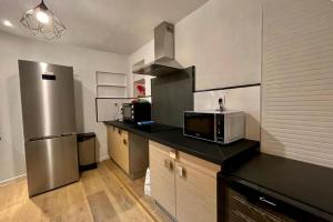 Кухня или мини-кухня в Le Triplex, Charmant appartement, 2 chambres

