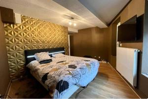 Кровать или кровати в номере Le Triplex, Charmant appartement, 2 chambres