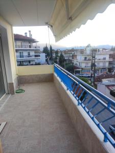 a balcony with a view of a city at GCM 1 ROOMS kentro k parking in Katerini