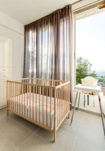 A bed or beds in a room at PanOrama View, Nilie Hospitality MGMT