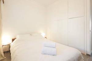 A bed or beds in a room at PanOrama View, Nilie Hospitality MGMT