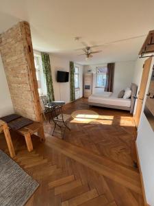 a living room with a couch and a table at Gasthof - Auszeit im Bad Diezlings - Adults only in Hörbranz