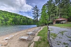 a group of chairs sitting on the shore of a lake at Sapphire Valley Retreat with Resort Amenities! in Sapphire
