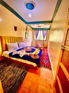 a bedroom with a bed and a rug at Atlas Views in Imlil