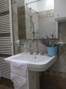 a bathroom with a sink with a towel on it at Agriturismo Renai e Monte in Gambassi Terme