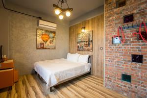 Postel nebo postele na pokoji v ubytování Yi Suo Yen Yu Homestay