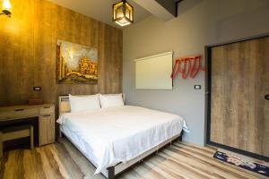 Postel nebo postele na pokoji v ubytování Yi Suo Yen Yu Homestay