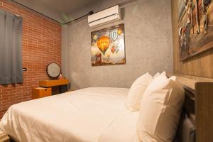 Postel nebo postele na pokoji v ubytování Yi Suo Yen Yu Homestay
