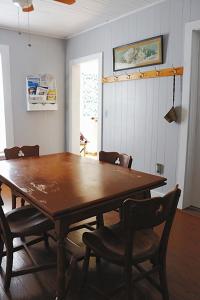 a dining room with a wooden table and chairs at Sweet Mary home in Jamestown