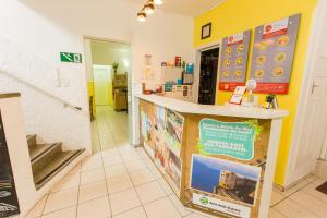 a shop with a counter with a train on it at Hotel Blumenau Centro in Curitiba