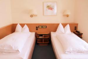 Postel nebo postele na pokoji v ubytování Hotel Garni Am Schäfersberg