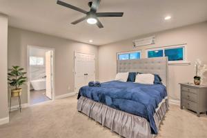 a bedroom with a bed and a ceiling fan at Stylish College Park Home with Private Garden! in Atlanta